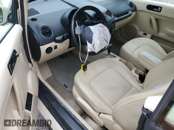2009 Volkswagen Beetle S with VIN 3VWRF31Y99M409195, listed as a Copart auction lot 55010054 with 99,635 mi miles and Salvage title. Bid and sale history available at DreamBid. Image 8.