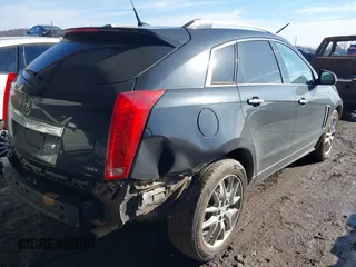 2014 Cadillac SRX Premium Collection z VIN 3GYFNDE34ES581728, wystawiony jako IAAI lot #41578226 z przebiegiem 121 118 mil mil oraz . Historia ofert i sprzedaży dostępna na DreamBid. Obrazek 4.