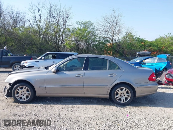 2003 Mercedes-Benz E-Class 3.2L with VIN WDBUF65J93X099223, listed as a IAAI auction lot 42033473 with 230,758 mi miles. Bid and sale history available at carsss.com. Image 14.