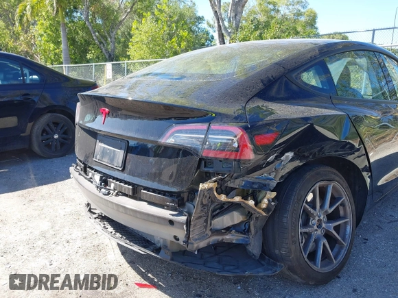 2023 Tesla Model 3 with VIN 5YJ3E1EAXPF623403, listed as a IAAI auction lot 41829543 with 29,414 mi miles and . Bid and sale history available at carsss.com. Image 6.