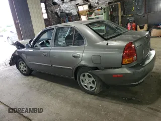 2005 Hyundai Accent GLS with VIN KMHCG45C95U632932, listed as a Copart auction lot 69448004 with 0 mi miles and Salvage Title. Bid and sale history available at carsss.com. Image 2.