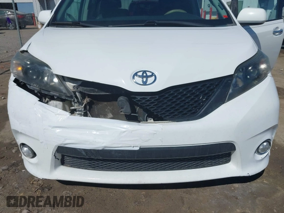 2014 Toyota Sienna SE with VIN 5TDXK3DC0ES477207, listed as a IAAI auction lot 41624619 with 213,881 mi miles and . Bid and sale history available at DreamBid. Image 6.