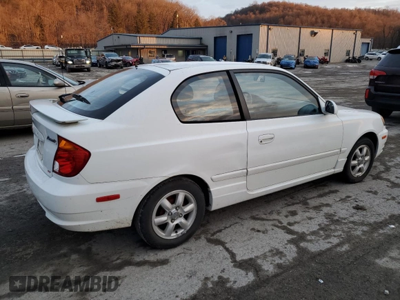 2003 Hyundai Accent GL with VIN KMHCG35C53U258469, listed as a Copart auction lot 82977294 with 99,136 mi miles and Clean Title. Bid and sale history available at carsss.com. Image 3.