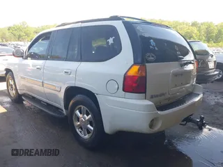 2003 GMC Envoy SLT with VIN 1GKDT13S432190085, listed as a IAAI auction lot 42106915 with 289,933 mi miles. Bid and sale history available at carsss.com. Image 3.
