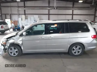 2009 Honda Odyssey Touring с VIN 5FNRL38979B005813, выставлен на аукционе IAAI как лот 41049383 с пробегом 174 897 миль миль и . История ставок и продаж доступна на DreamBid. Изображение 14.