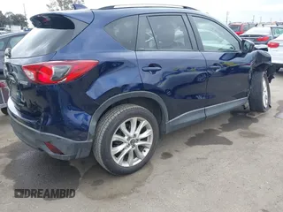 2014 Mazda CX-5 Grand Touring with VIN JM3KE2DY1E0307911, listed as a IAAI auction lot 42064898 with 133,934 mi miles. Bid and sale history available at carsss.com. Image 4.