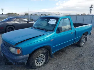 1995 Mazda B-Series Truck z VIN 4F4CR12A0STM09915, wystawiony jako IAAI lot #41773728 z przebiegiem 90 000 mil mil oraz . Historia ofert i sprzedaży dostępna na DreamBid. Obrazek 2.