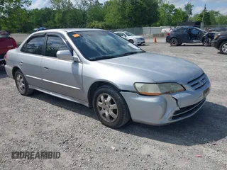 2002 Honda Accord EX z VIN 1HGCG56612A142289, wystawiony jako IAAI lot #42253862 z przebiegiem 234 406 mil mil oraz . Historia ofert i sprzedaży dostępna na DreamBid. Obrazek 1.