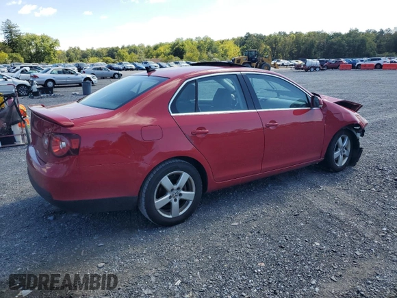 2009 Volkswagen Jetta SE with VIN 3VWRZ71K69M177746, listed as a Copart auction lot 70990074 with 128,390 mi miles and Salvage title. Bid and sale history available at DreamBid. Image 3.