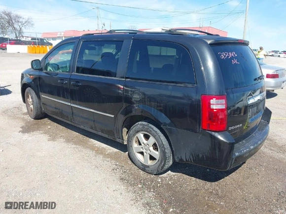 2010 Dodge Grand Caravan SXT with VIN 2D4RN5D18AR233143, listed as a IAAI auction lot 41880502 with 145,356 mi miles. Bid and sale history available at carsss.com. Image 3.