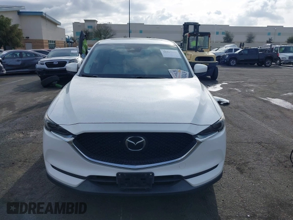 2018 Mazda CX-5 Grand Touring with VIN JM3KFADMXJ0470846, listed as a IAAI auction lot 41913533 with 54,700 mi miles and . Bid and sale history available at DreamBid. Image 13.