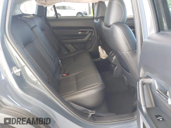 2023 Mazda CX-50 Premium Plus with VIN 7MMVABEY8PN100311, listed as a IAAI auction lot 42626276 with 40,242 mi miles and . Bid and sale history available at DreamBid. Image 8.