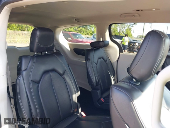 2023 Chrysler Pacifica Touring L with VIN 2C4RC1BG1PR606566, listed as a IAAI auction lot 42615498 with 42,980 mi miles and . Bid and sale history available at DreamBid. Image 8.