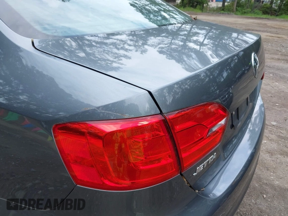 2014 Volkswagen Jetta SE with VIN 3VWD07AJ0EM236487, listed as a IAAI auction lot 42714441 with 124,596 mi miles and . Bid and sale history available at DreamBid. Image 14.