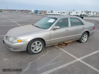 2002 Mazda 626 LX with VIN 1YVGF22DX25263864, listed as a IAAI auction lot 41846129 with 282,516 mi miles. Bid and sale history available at carsss.com. Image 2.