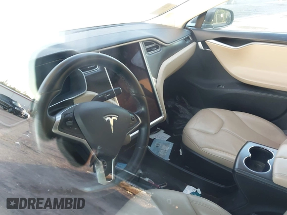 2014 Tesla Model S 60 z VIN 5YJSA1H19EFP51406, wystawiony jako IAAI lot #41561395 z przebiegiem Nie podano mil oraz . Historia ofert i sprzedaży dostępna na DreamBid. Obrazek 18.