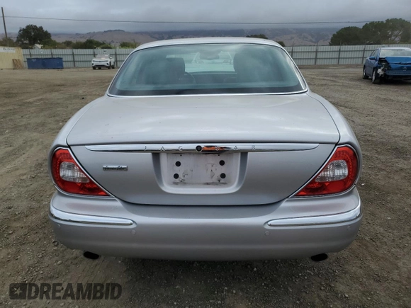 2004 Jaguar XJ with VIN SAJEA74C34SG09548, listed as a Copart auction lot 71754774 with 142,804 mi miles and Salvage Title. Bid and sale history available at DreamBid. Image 6.