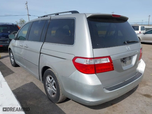 2005 Honda Odyssey EX-L with VIN 5FNRL38745B126338, listed as a IAAI auction lot 41991119 with 165,552 mi miles. Bid and sale history available at carsss.com. Image 3.