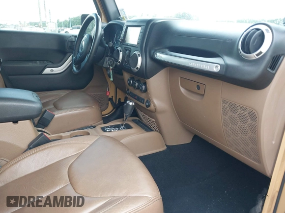 2013 Jeep Wrangler Unlimited Sahara with VIN 1C4BJWEG8DL638404, listed as a IAAI auction lot 42586604 with 43,953 mi miles and . Bid and sale history available at DreamBid. Image 5.