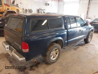 2003 Dodge Dakota SLT with VIN 1D7HL48N63S177233, listed as a IAAI auction lot 42167711 with 163,511 mi miles and . Bid and sale history available at carsss.com. Image 4.