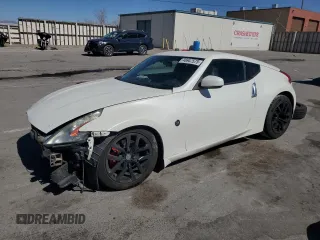 2014 Nissan 370Z Nismo with VIN JN1AZ4EH2EM633022, listed as a Copart auction lot 46947575 with 115,042 mi miles and Salvage Title. Bid and sale history available at DreamBid. Image 1.