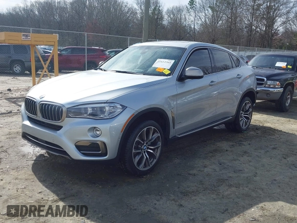 2019 BMW X6 xDrive35i z VIN 5UXKU2C52K0Z63984, wystawiony jako IAAI lot #41612265 z przebiegiem 65 634 mil mil oraz . Historia ofert i sprzedaży dostępna na DreamBid. Obrazek 2.