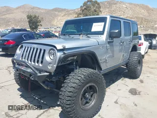 2018 Jeep Wrangler Unlimited Sport with VIN 1C4BJWDG4JL807265, listed as a IAAI auction lot 42520648 with 69,229 mi miles and . Bid and sale history available at DreamBid. Image 2.