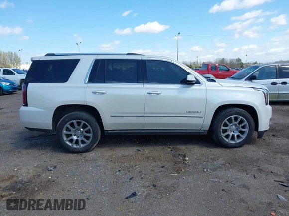 2015 GMC Yukon Denali with VIN 1GKS1CKJ5FR285199, listed as a IAAI auction lot 41763187 with 135,265 mi miles. Bid and sale history available at carsss.com. Image 13.