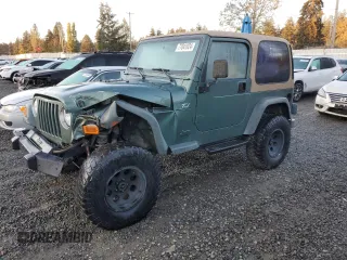 2000 Jeep Wrangler Sport with VIN 1J4FA49S1YP748529, listed as a Copart auction lot 77041924 with 154,949 mi miles and Salvage Title. Bid and sale history available at carsss.com. Image 1.
