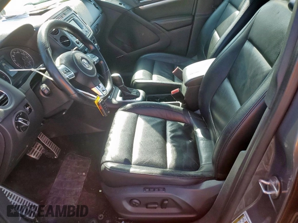 2014 Volkswagen Tiguan SEL z VIN WVGAV3AX6EW030705, wystawiony jako Copart lot #52156805 z przebiegiem 142 377 mil mil oraz Szkoda całkowita • Salvage title. Historia ofert i sprzedaży dostępna na DreamBid. Obrazek 7.