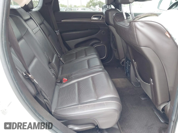 2014 Jeep Grand Cherokee Summit z VIN 1C4RJEJG1EC357948, wystawiony jako IAAI lot #42498652 z przebiegiem 213 715 mil mil oraz . Historia ofert i sprzedaży dostępna na DreamBid. Obrazek 8.