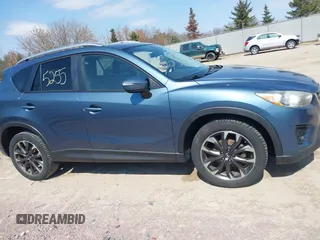 2016 Mazda CX-5 Grand Touring z VIN JM3KE4DY6G0785255, wystawiony jako IAAI lot #41887066 z przebiegiem 171 334 mil mil oraz . Historia ofert i sprzedaży dostępna na DreamBid. Obrazek 14.