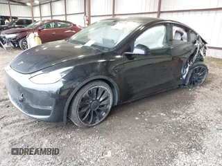 2023 Tesla Model Y Performance with VIN 7SAYGDEF2PF800641, listed as a IAAI auction lot 41612596 with 60,984 mi miles and . Bid and sale history available at DreamBid. Image 2.
