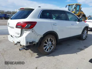 2014 Mazda CX-9 Grand Touring with VIN JM3TB3DA8E0427369, listed as a IAAI auction lot 41860129 with 152,888 mi miles and . Bid and sale history available at DreamBid. Image 4.