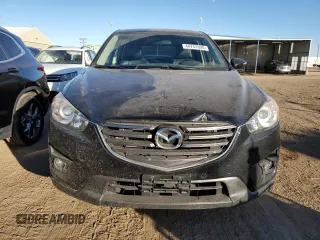 2016 Mazda CX-5 Grand Touring with VIN JM3KE4DY0G0731384, listed as a Copart auction lot 44741695 with 58,727 mi miles and Salvage Title. Bid and sale history available at carsss.com. Image 5.