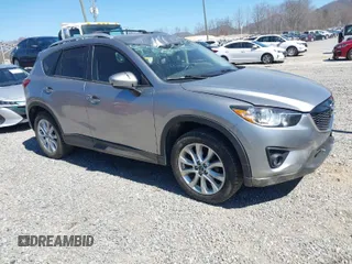 2014 Mazda CX-5 Grand Touring with VIN JM3KE4DY3E0368169, listed as a IAAI auction lot 41857976 with 127,853 mi miles. Bid and sale history available at carsss.com. Image 1.