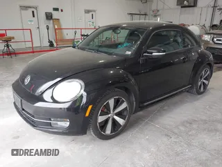2012 Volkswagen Beetle 2.0T Turbo w/Sun/Snd/Nav PZEV with VIN 3VWVA7AT8CM617830, listed as a IAAI auction lot 42024546 with 91,688 mi miles. Bid and sale history available at carsss.com. Image 2.
