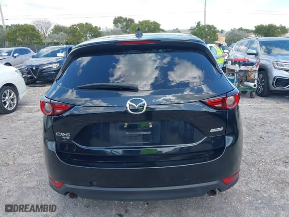 2018 Mazda CX-5 Grand Touring with VIN JM3KFBDM2J0390611, listed as a IAAI auction lot 42006482 with 97,497 mi miles. Bid and sale history available at carsss.com. Image 16.