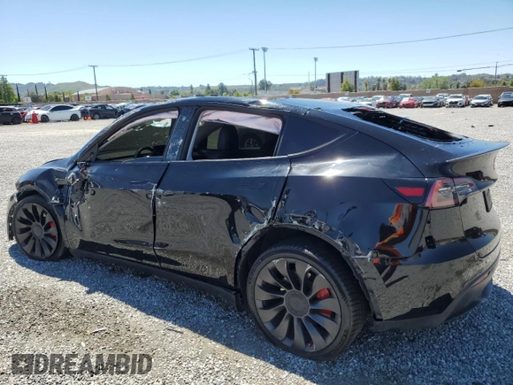 2022 Tesla Model Y Performance z VIN 7SAYGDEF0NF540933, wystawiony jako Copart lot #56087145 z przebiegiem 59 717 mil mil oraz Szkoda całkowita • Salvage title. Historia ofert i sprzedaży dostępna na DreamBid. Obrazek 2.