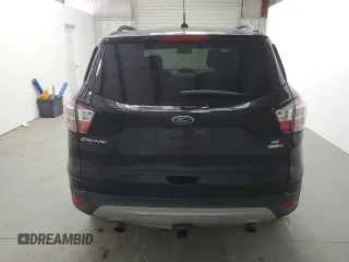 2018 Ford Escape SE z VIN 1FMCU9GD9JUD21474, wystawiony jako Copart lot #53921535 z przebiegiem 136 819 mil mil oraz Czysty tytuł • Clean title. Historia ofert i sprzedaży dostępna na DreamBid. Obrazek 6.