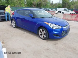 2014 Hyundai Veloster with VIN KMHTC6AD2EU184927, listed as a IAAI auction lot 42133499 with 103,499 mi miles. Bid and sale history available at carsss.com. Image 1.
