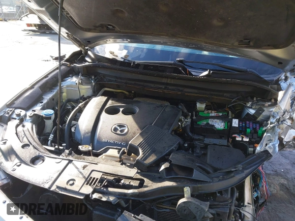 2020 Mazda CX-5 Grand Touring z VIN JM3KFADM0L0738337, wystawiony jako IAAI lot #41485078 z przebiegiem Nie podano mil oraz . Historia ofert i sprzedaży dostępna na DreamBid. Obrazek 10.