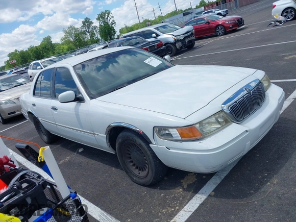 2001 Mercury Grand Marquis LS with VIN 2MEFM75W71X614856, listed as a IAAI auction lot 42195921 with 113,352 mi miles and . Bid and sale history available at DreamBid. Image 1.