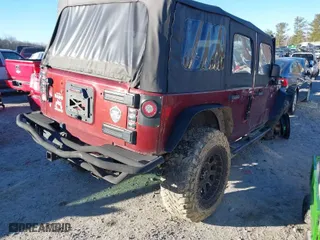 2010 Jeep Wrangler Unlimited Sport with VIN 1J4BA3H17AL107173, listed as a IAAI auction lot 41361595 with 245,624 mi miles. Bid and sale history available at carsss.com. Image 4.