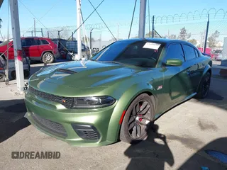 2022 Dodge Charger Scat Pack Widebody with VIN 2C3CDXGJ1NH216763, listed as a IAAI auction lot 41259159 with 32,610 mi miles and . Bid and sale history available at DreamBid. Image 2.