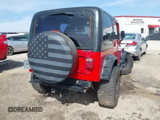 2002 Jeep Wrangler Sport with VIN 1J4FA49S42P771262, listed as a IAAI auction lot 41819403 with 132,871 mi miles. Bid and sale history available at carsss.com. Image 4.