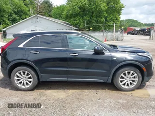2019 Cadillac XT4 AWD Luxury z VIN 1GYFZBR41KF150209, wystawiony jako IAAI lot #42325529 z przebiegiem 76 828 mil mil oraz . Historia ofert i sprzedaży dostępna na DreamBid. Obrazek 13.