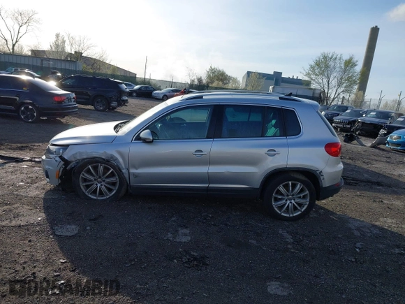 2013 Volkswagen Tiguan S with VIN WVGAV3AX0DW572915, listed as a IAAI auction lot 41937763 with 65,136 mi miles and . Bid and sale history available at DreamBid. Image 14.