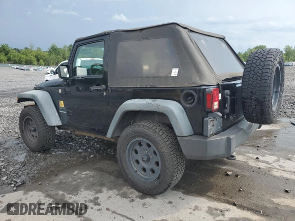 2011 Jeep Wrangler Sport z VIN 1J4GA2D16BL511735, wystawiony jako Copart lot #63292705 z przebiegiem 136 609 mil mil oraz Szkoda całkowita • Salvage title. Historia ofert i sprzedaży dostępna na DreamBid. Obrazek 2.