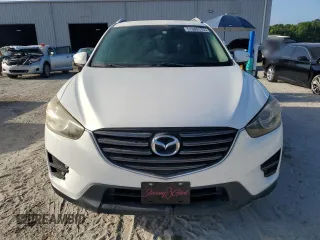 2016 Mazda CX-5 Sport with VIN JM3KE2BY9G0743167, listed as a Copart auction lot 51309175 with 84,192 mi miles and Clean Title. Bid and sale history available at carsss.com. Image 5.
